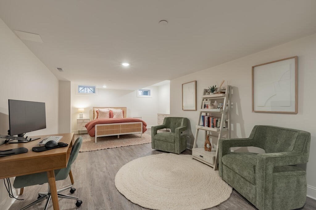 165 Cambridge Road, Unit 10 Woburn, MA 01801 - Photo 27 of 33 a living room with furniture and a flat screen tv