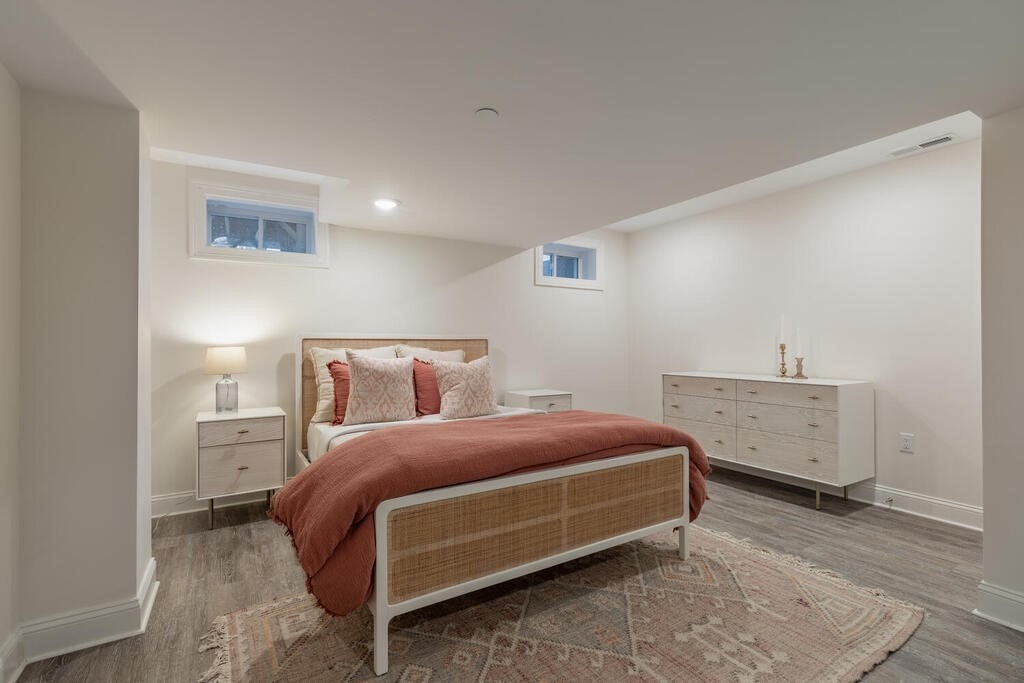 165 Cambridge Road, Unit 10 Woburn, MA 01801 - Photo 28 of 33 a bedroom with a bed and window