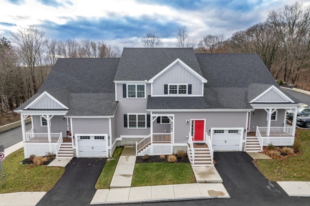 165 Cambridge Road, Unit 10 Woburn, MA 01801 - Photo 29 of 33 a house that has lots of windows in it