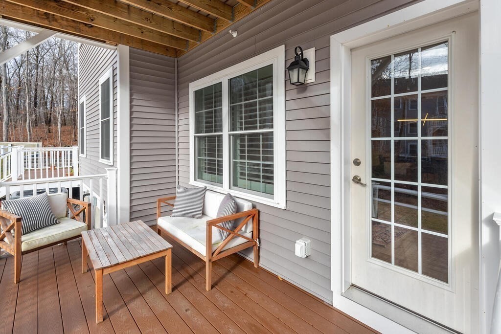 165 Cambridge Road, Unit 10 Woburn, MA 01801 - Photo 30 of 33 a outdoor living space with furniture and a window