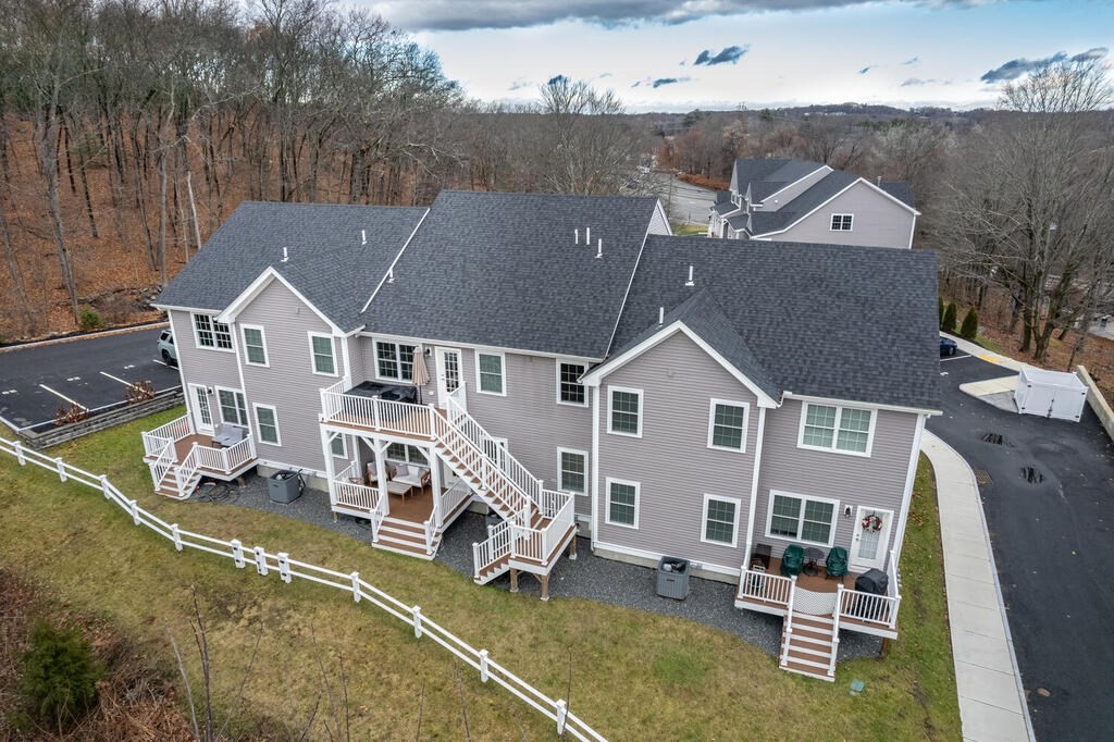 165 Cambridge Road, Unit 10 Woburn, MA 01801 - Photo 32 of 33 an aerial view of a house with a garden