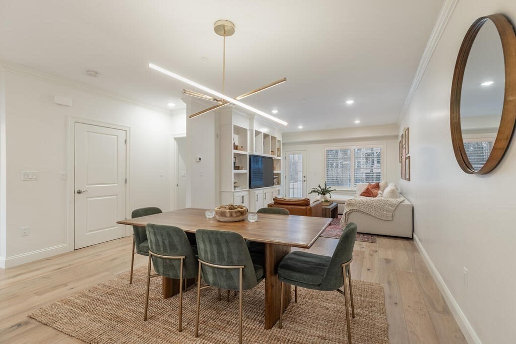 165 Cambridge Road, Unit 10 Woburn, MA 01801 - Photo 8 of 33 a view of a dining room with furniture