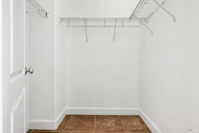 an aerial view of a house with a yard and garden