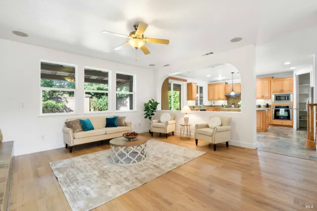 a view of a dining room with furniture and a chandelier