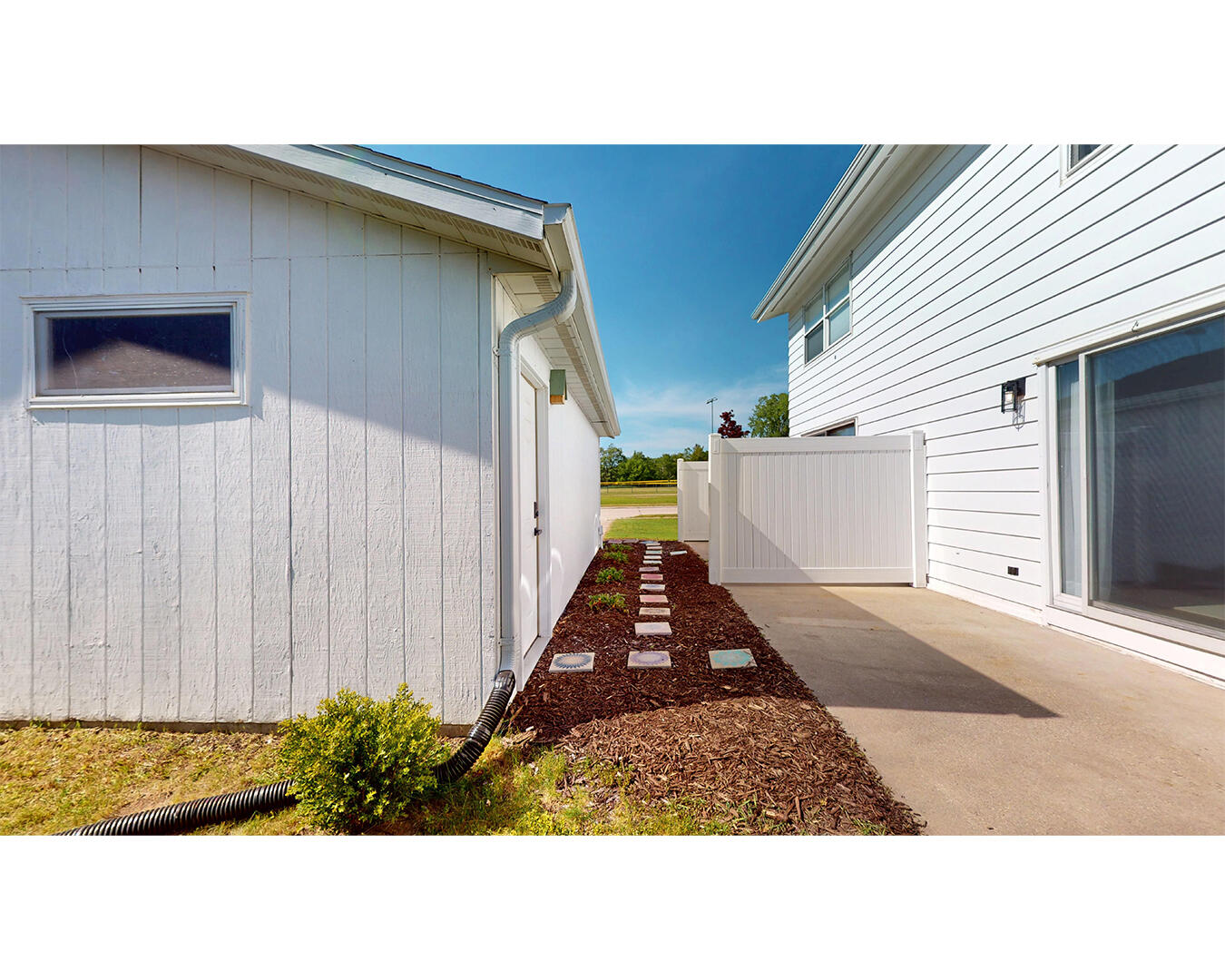 3412 Wilson Street Two Rivers, WI 54241 - Photo 25 of 31 Patio, Garage, Path to Driveway