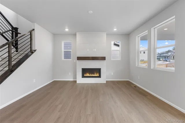 a view of an empty room and fire place