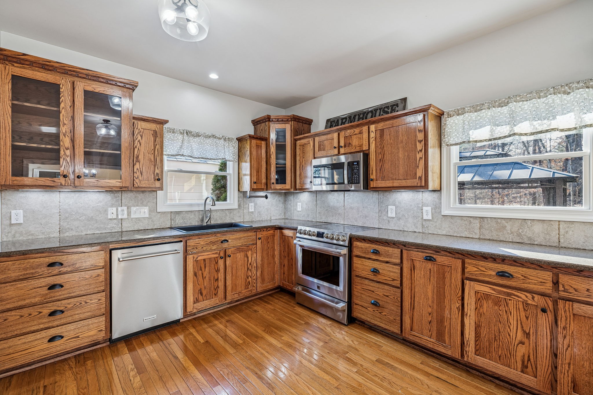 3840 East Compton Road Murfreesboro, TN 37130 - Photo 11 of 51 a kitchen with stainless steel appliances granite countertop a sink and cabinets