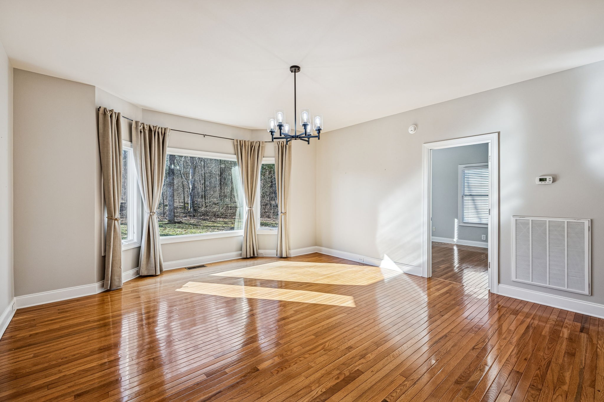 3840 East Compton Road Murfreesboro, TN 37130 - Photo 13 of 51 a view of empty room with wooden floor and fan