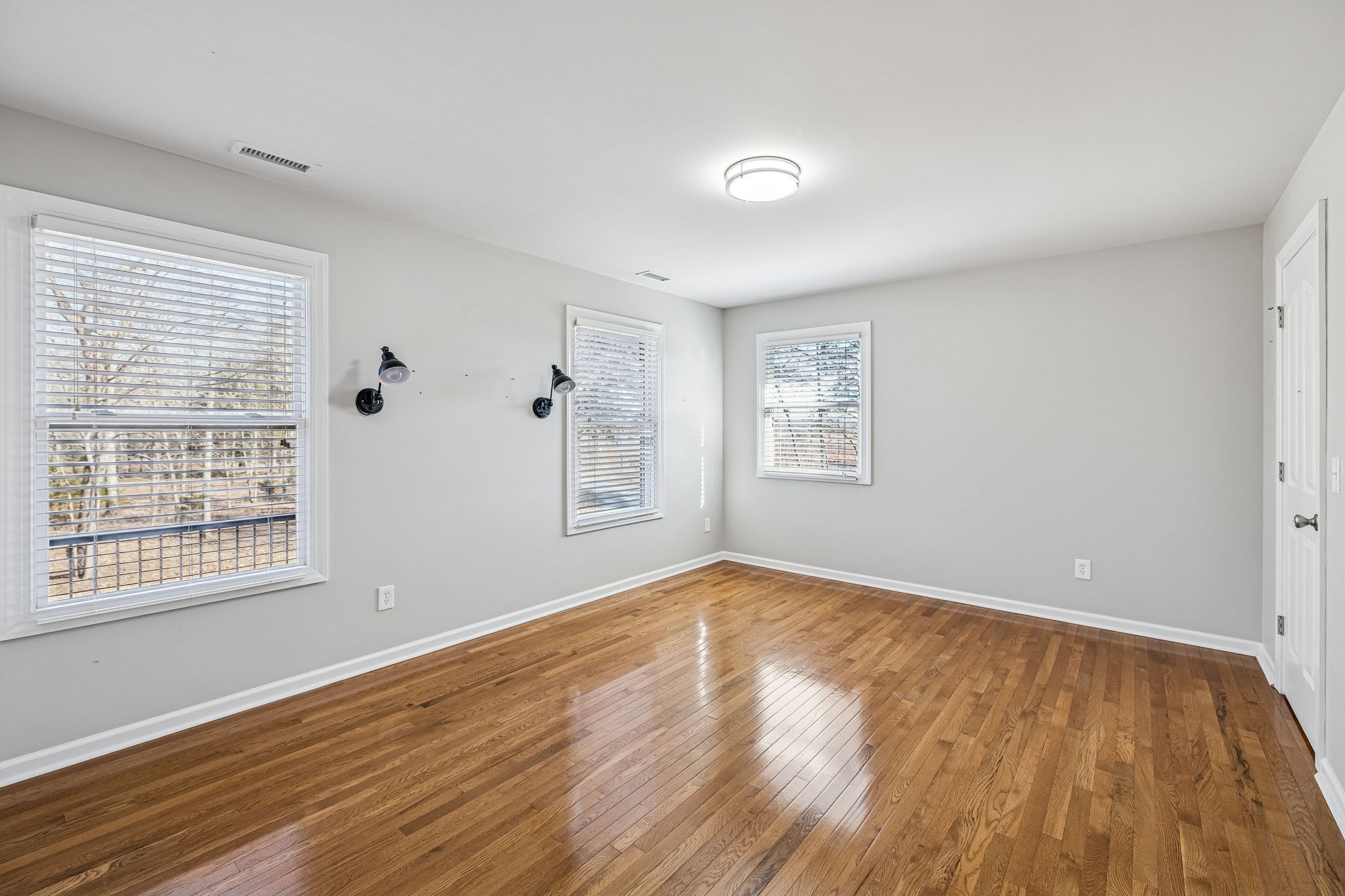 3840 East Compton Road Murfreesboro, TN 37130 - Photo 26 of 51 a view of an empty room with wooden floor and a window