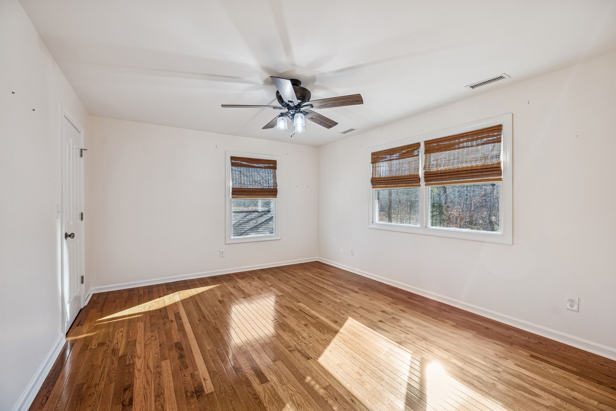 3840 East Compton Road Murfreesboro, TN 37130 - Photo 28 of 51 a view of empty room with wooden floor and fan