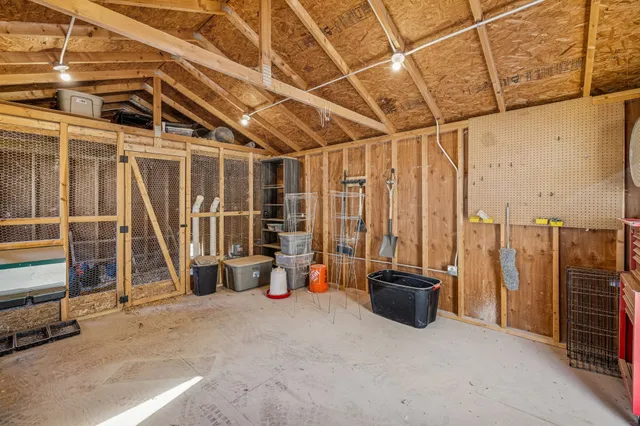 a view of a house with a yard covered in snow