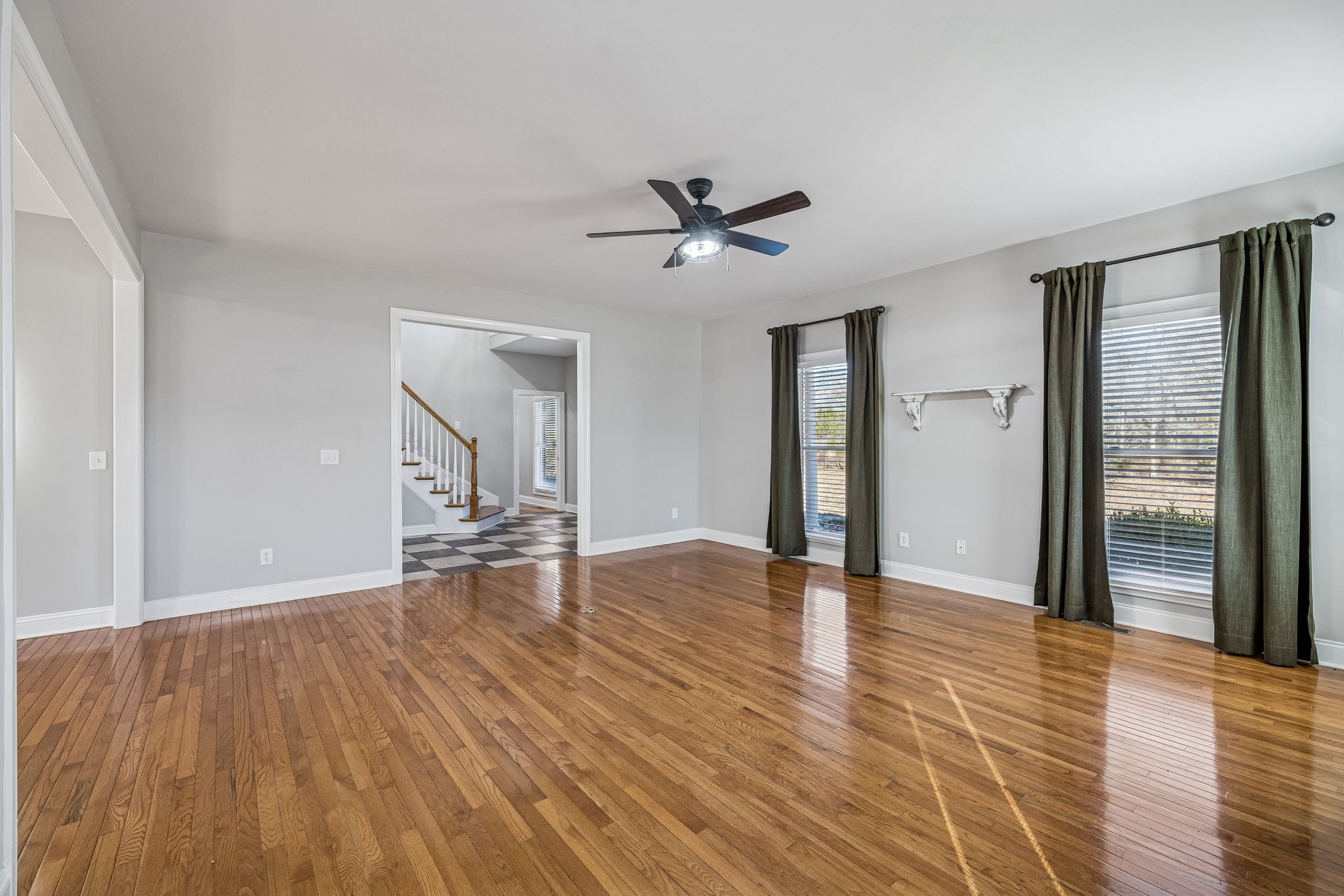 3840 East Compton Road Murfreesboro, TN 37130 - Photo 7 of 51 a view of empty room with wooden floor and fan