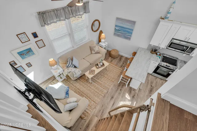 a view of living room with furniture and rug