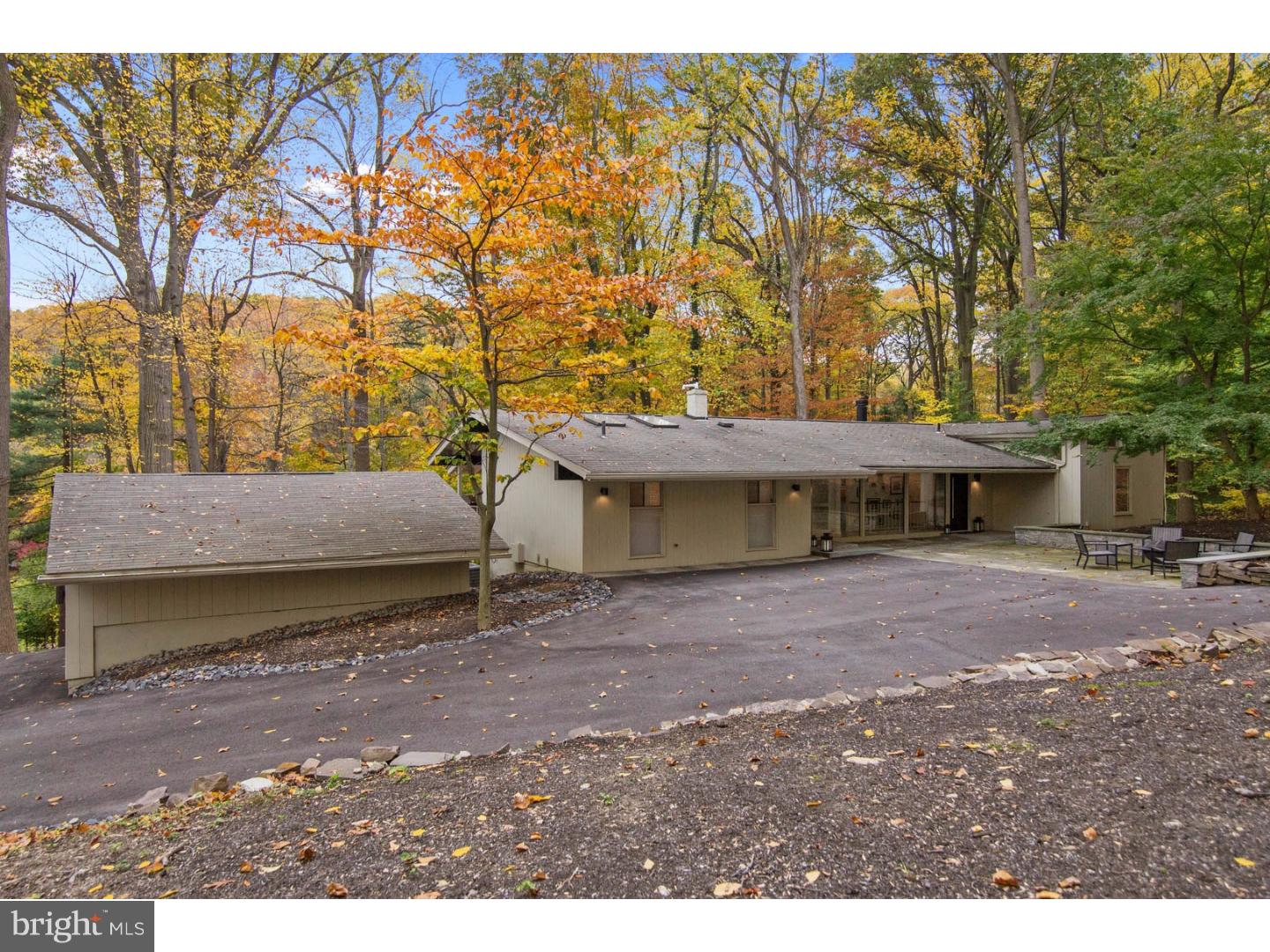 356 Pugh Road Wayne, PA 19087 - Photo 2 of 25 a backyard of a house with a table and chairs