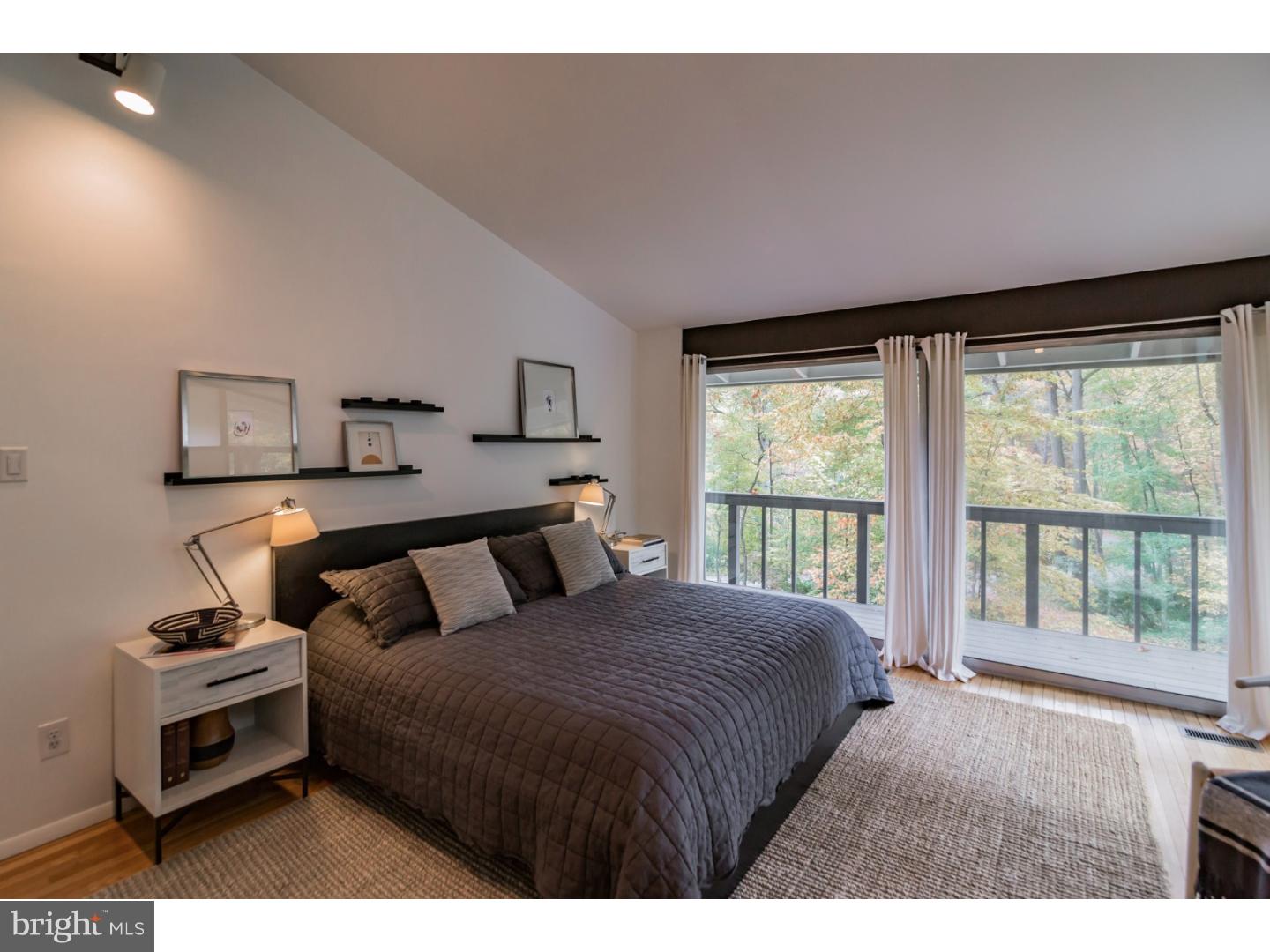 356 Pugh Road Wayne, PA 19087 - Photo 15 of 25 a bedroom with a bed and a large window