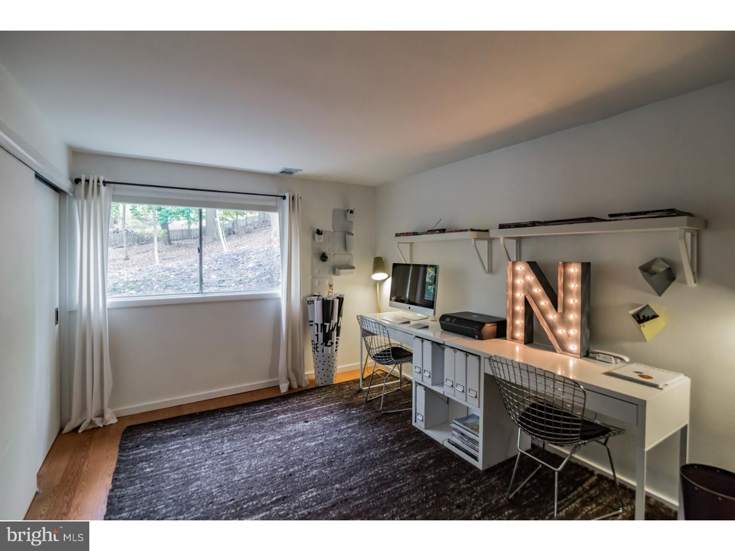 356 Pugh Road Wayne, PA 19087 - Photo 22 of 25 a view of a workspace with furniture and a window