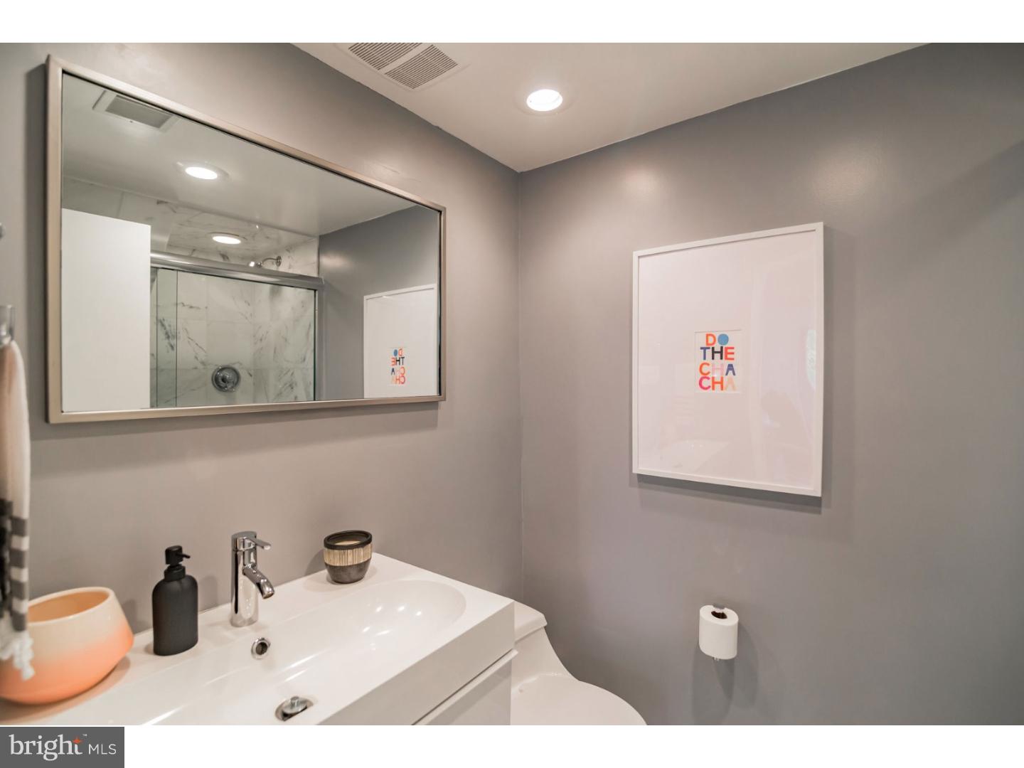 356 Pugh Road Wayne, PA 19087 - Photo 25 of 25 a bathroom with a sink a mirror and a toilet