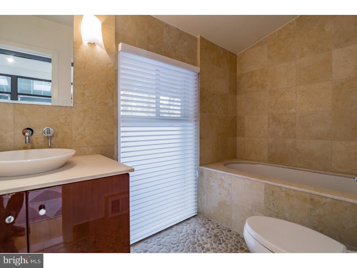 356 Pugh Road Wayne, PA 19087 - Photo 8 of 25 a bathroom with a sink and a mirror