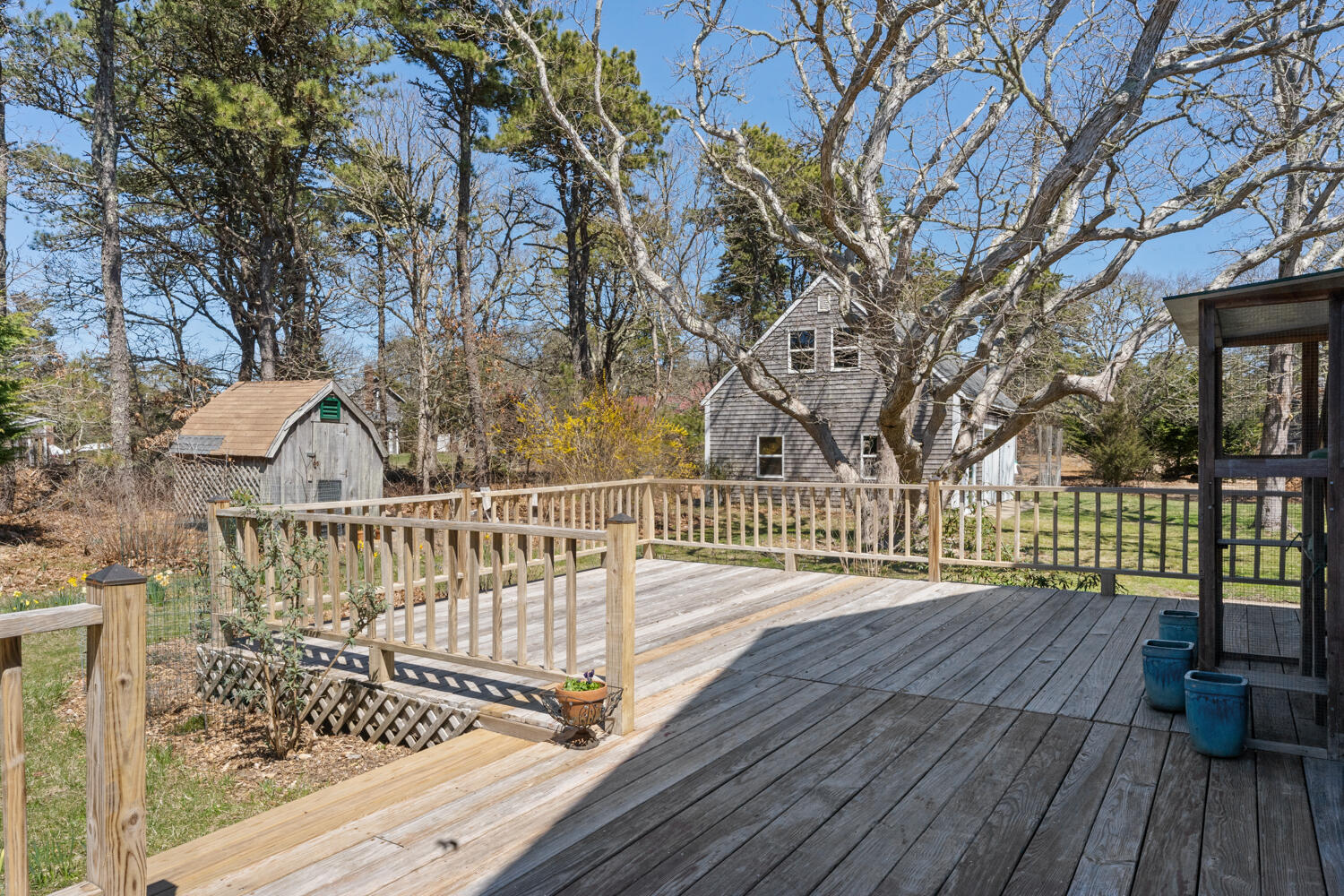9 Sampson Avenue Edgartown, MA 02539 - Photo 25 of 35 a balcony with wooden floor and trees