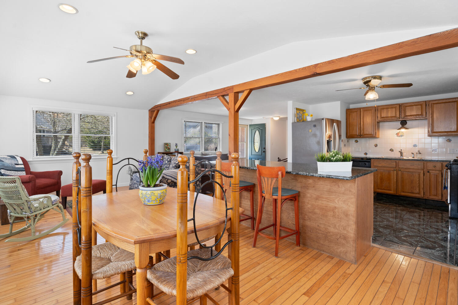 9 Sampson Avenue Edgartown, MA 02539 - Photo 6 of 35 a view of a dining room and livingroom with furniture wooden floor a chandelier