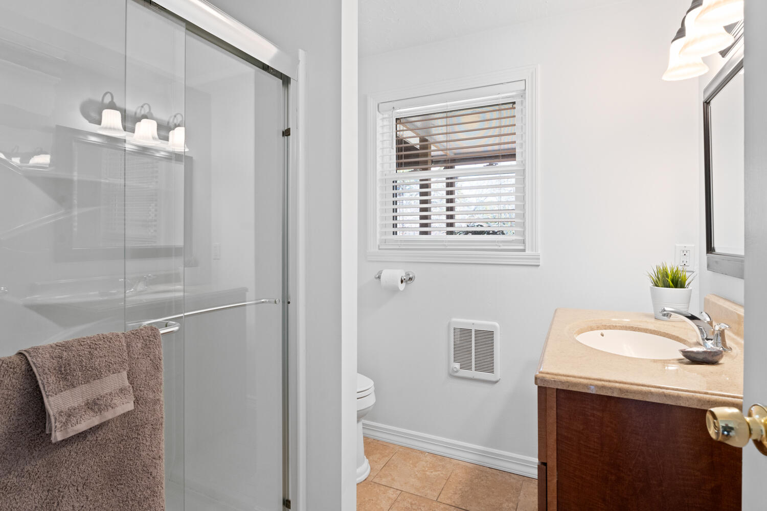 9 Sampson Avenue Edgartown, MA 02539 - Photo 10 of 35 a bathroom with a sink a mirror and a shower