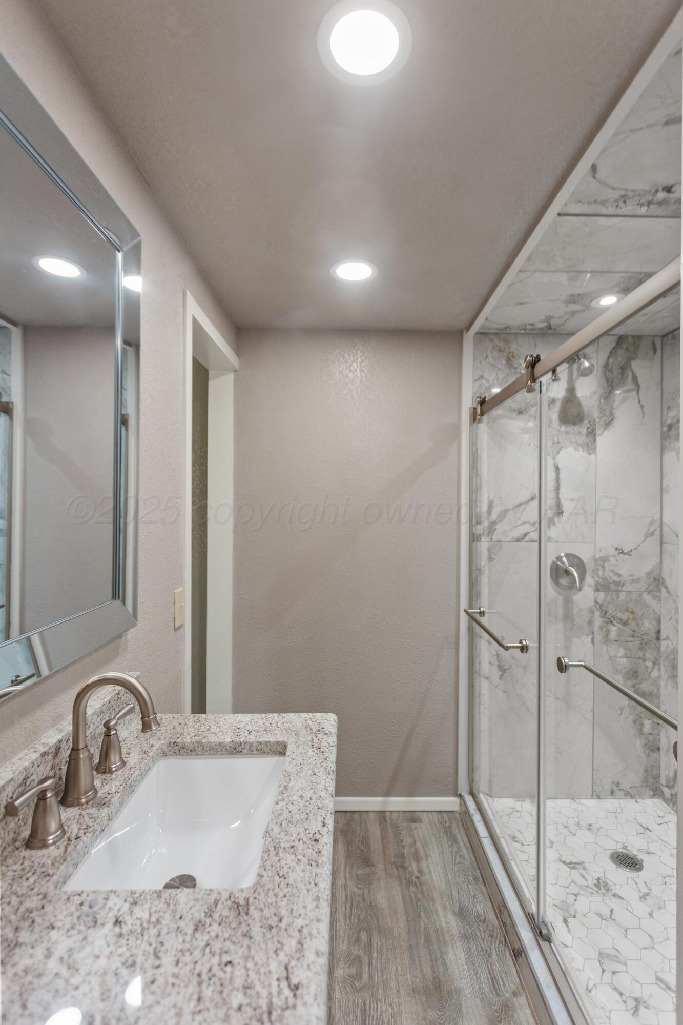 1119 South Main Street Wheeler, TX 79096 - Photo 34 of 49 a bathroom with a sink and shower