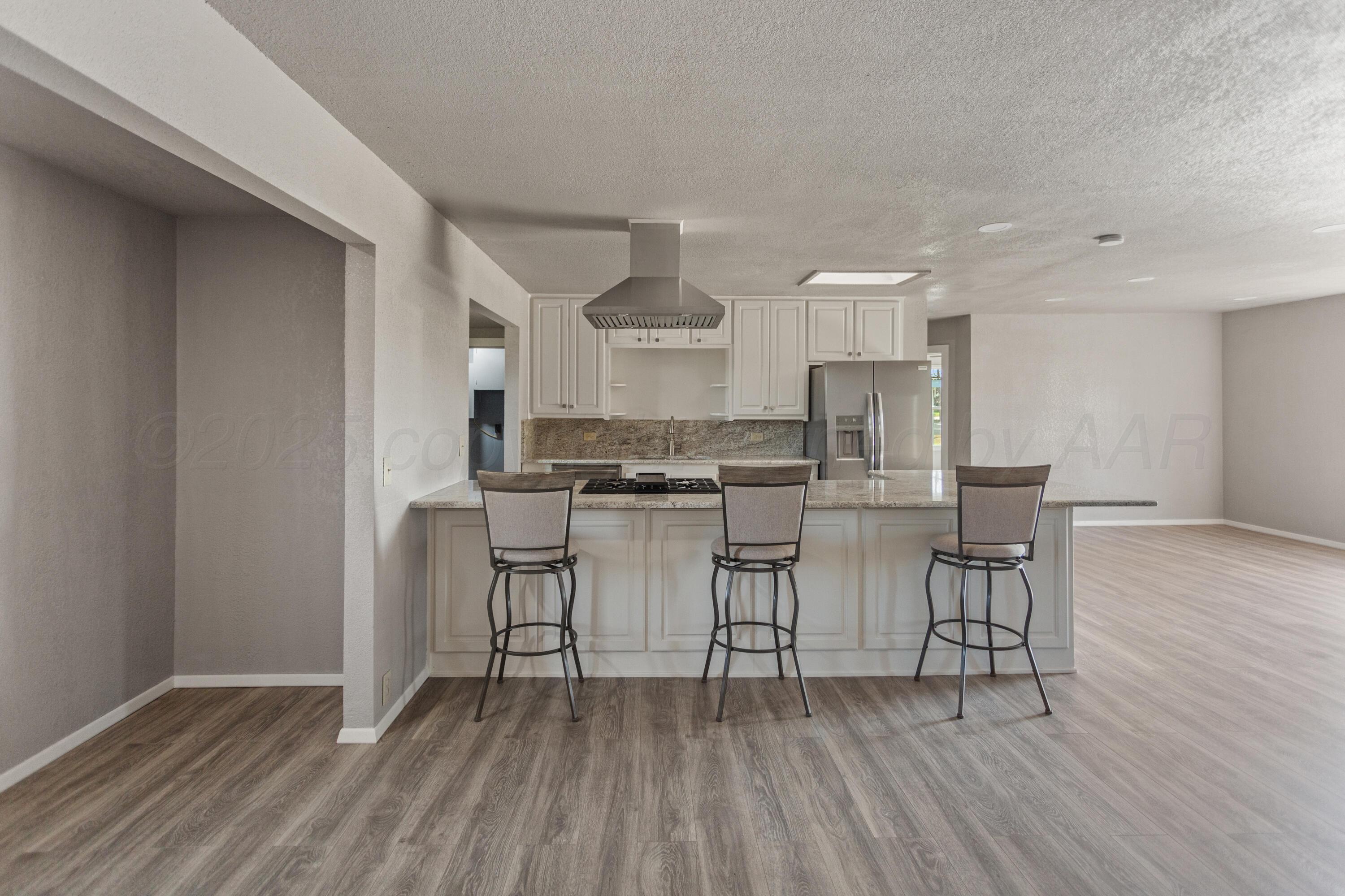 1119 South Main Street Wheeler, TX 79096 - Photo 6 of 49 a kitchen with cabinets table and chairs