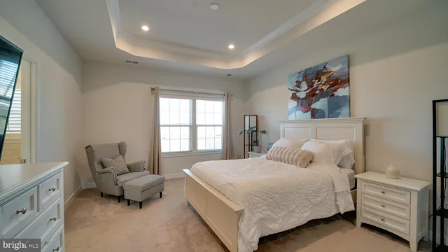 a bedroom with a bed and a couch