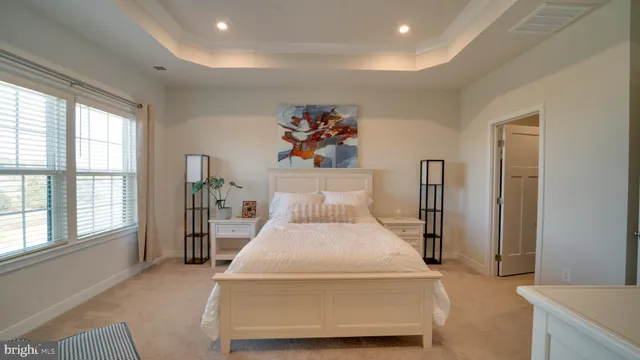 a bed room with a bed and a chandelier