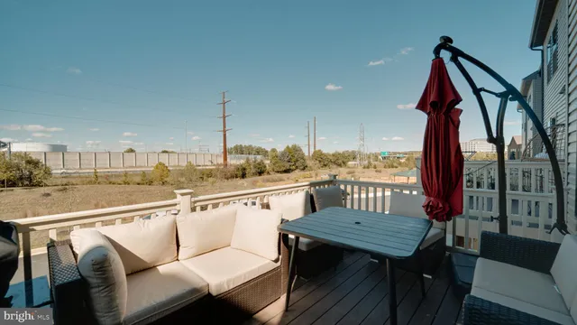 a view of a balcony with furniture