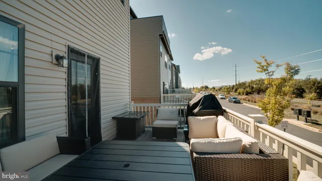 a view of a balcony with furniture
