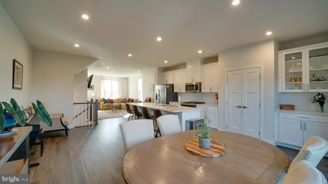 a living room with kitchen island furniture and a table