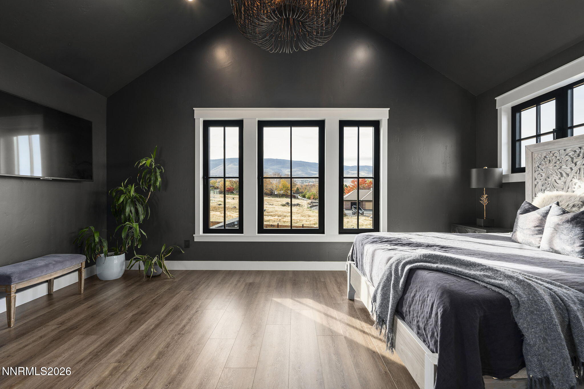 1426 Foothill Road Reno, NV 89511 - Photo 26 of 100 a bed sitting in a bedroom next to a window