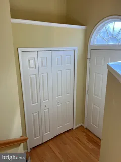 a view of front door with wooden floor