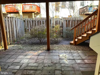 a view of a pathway of a house with a porch