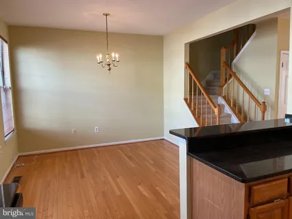 a view of a hallway with stairs