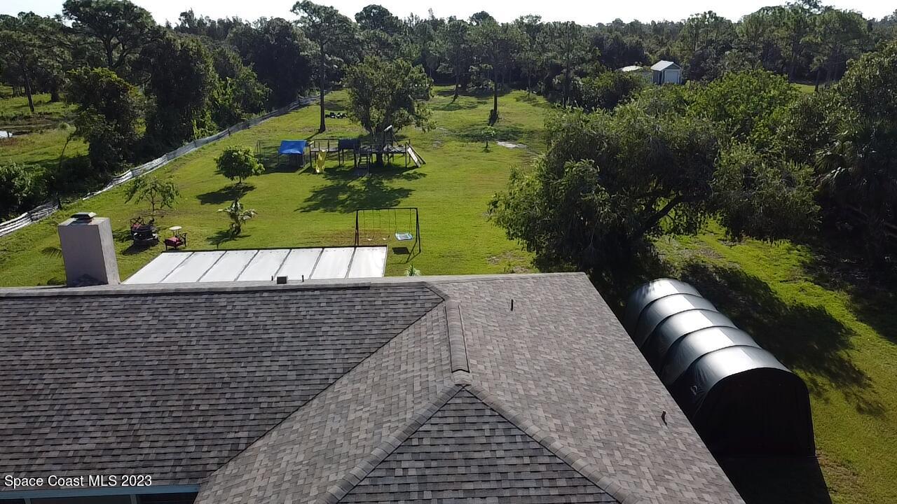 2745 Corey Road Malabar, FL 32950 - Photo 35 of 39 a view of a swimming pool with a yard