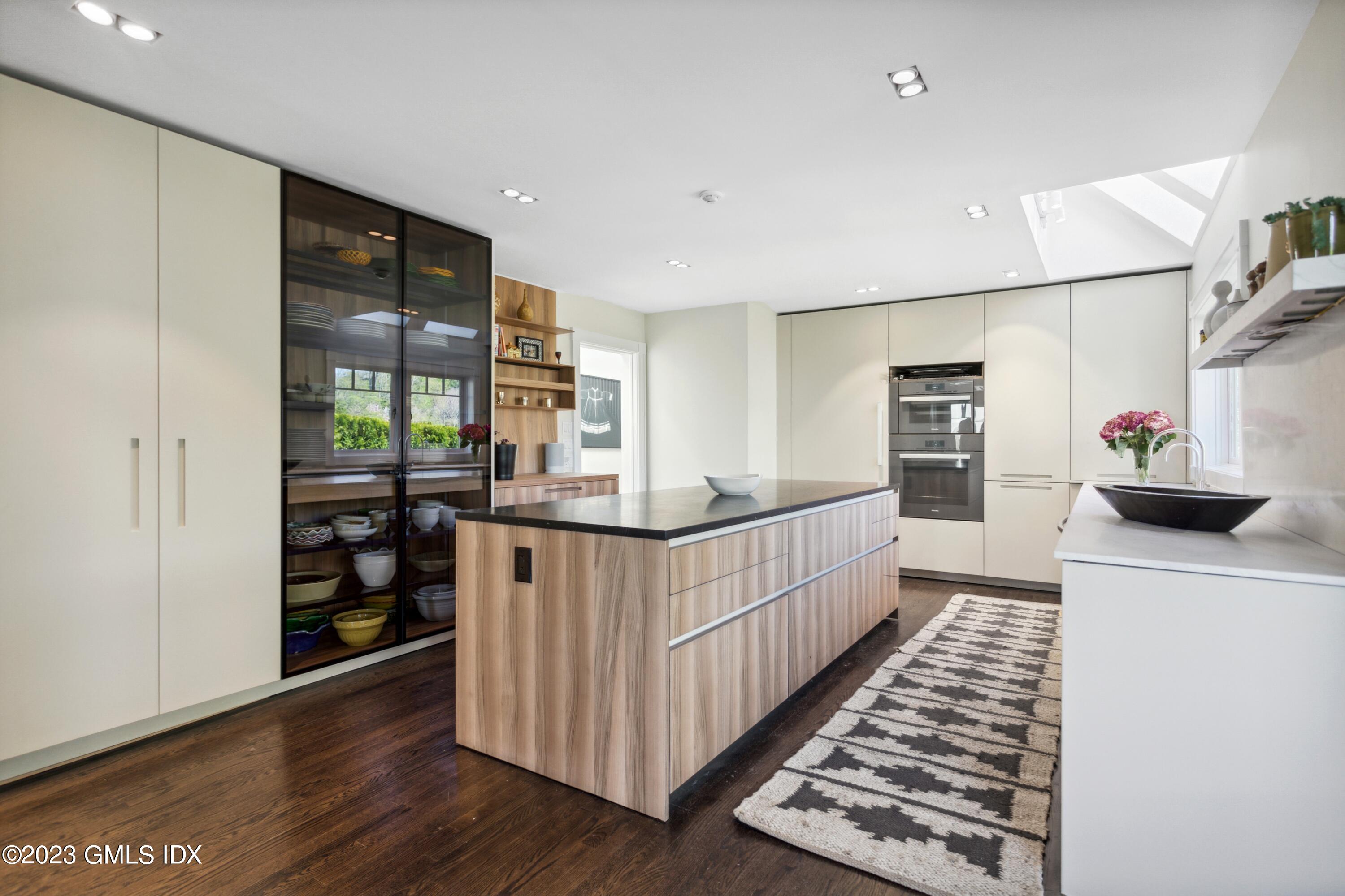61 Byram Shore Road Greenwich, CT 06830 - Photo 11 of 36 a view of a kitchen with fridge and wooden floor