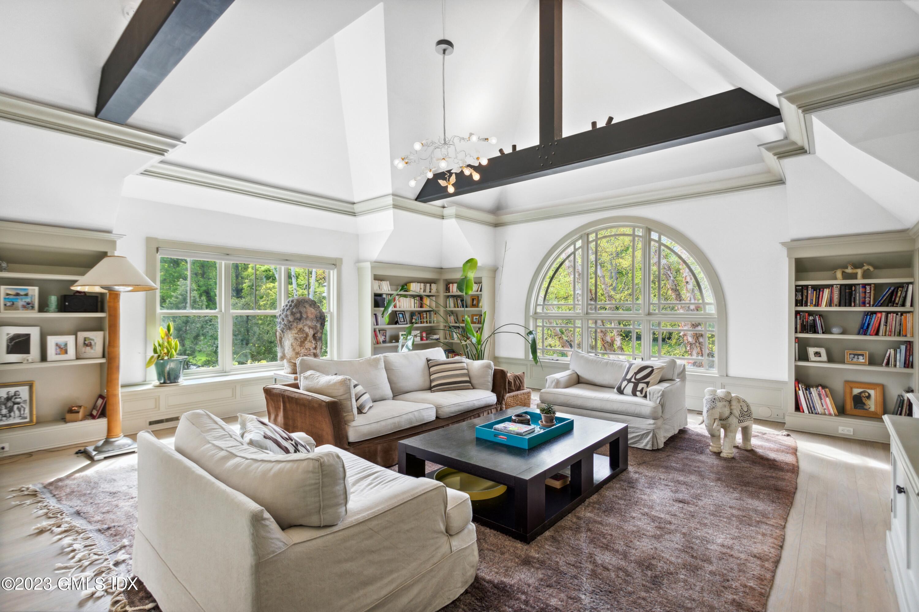 61 Byram Shore Road Greenwich, CT 06830 - Photo 13 of 36 a living room with furniture and a large window