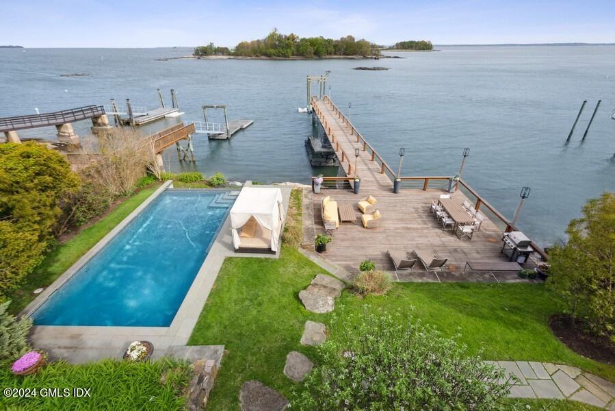 61 Byram Shore Road Greenwich, CT 06830 - Photo 28 of 36 an aerial view of a house with a garden and lake view
