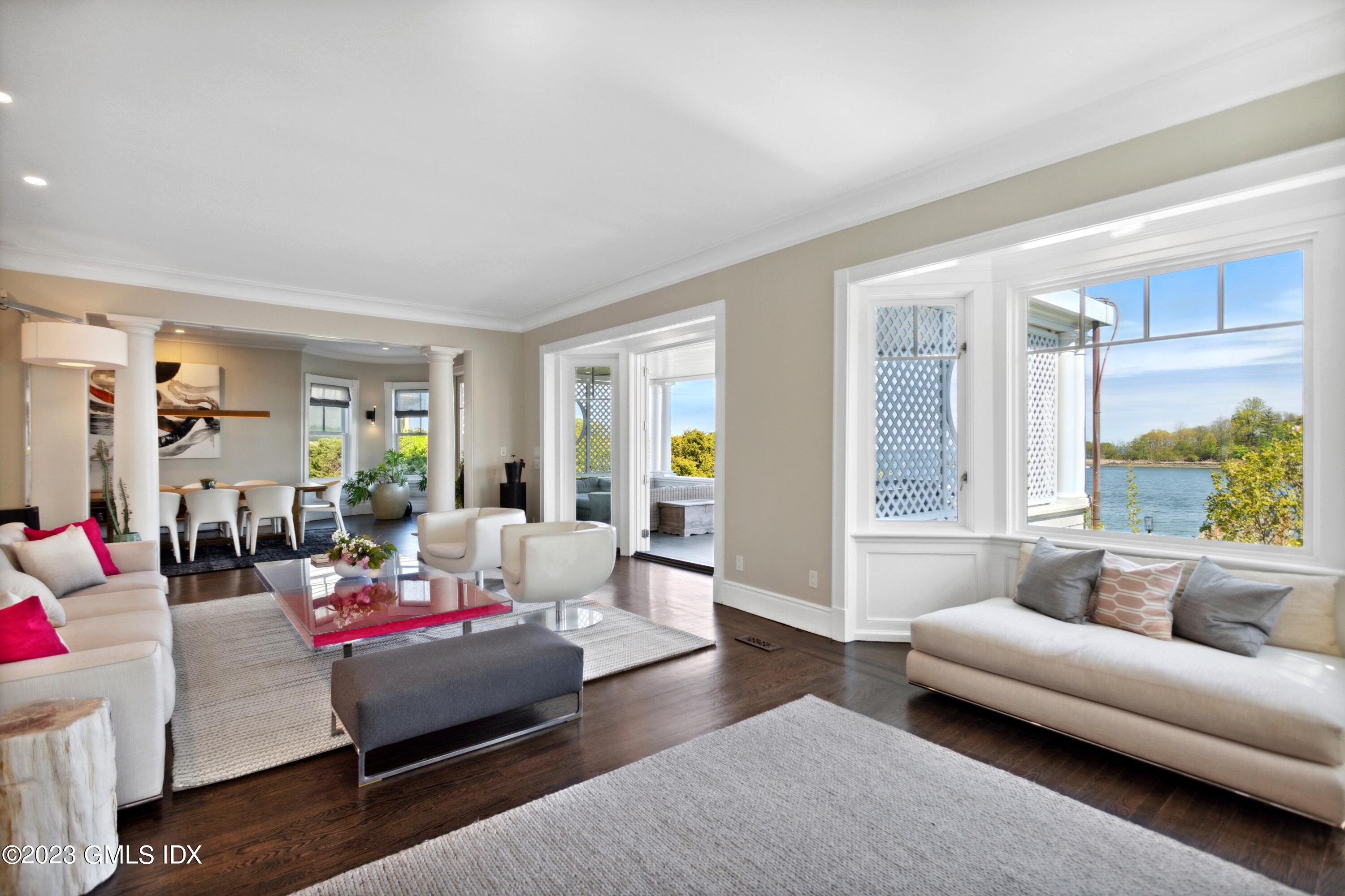 61 Byram Shore Road Greenwich, CT 06830 - Photo 7 of 36 a living room with furniture and a large window