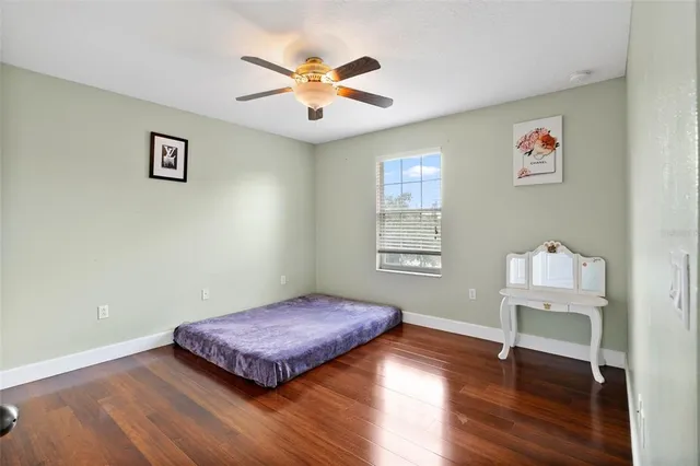 a workspace with wooden floor and a window