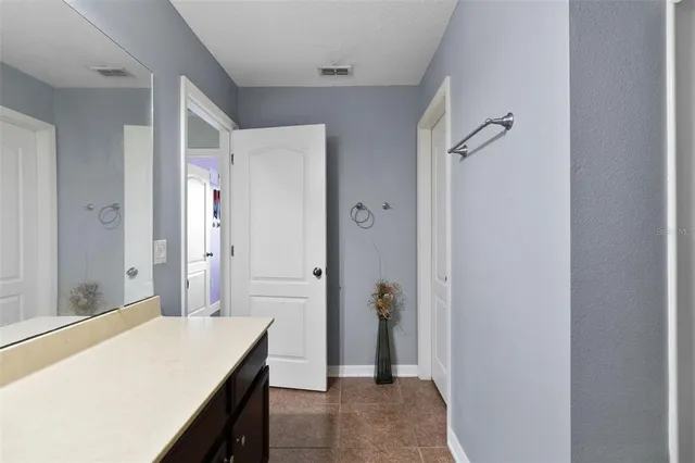 a front view of house with yard and trees