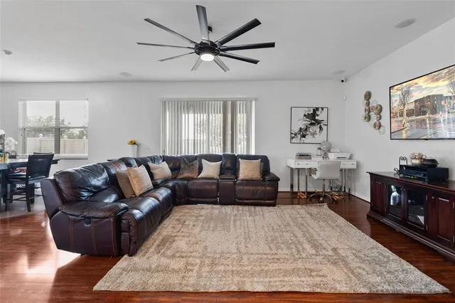 a kitchen with kitchen island granite countertop wooden cabinets and stainless steel appliances