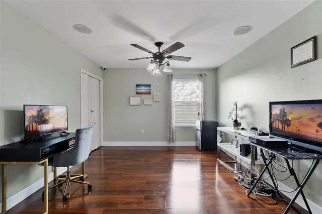 a view of a dining room with furniture and wooden floor