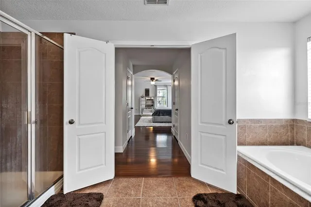 a bedroom with a bed and a dresser in it