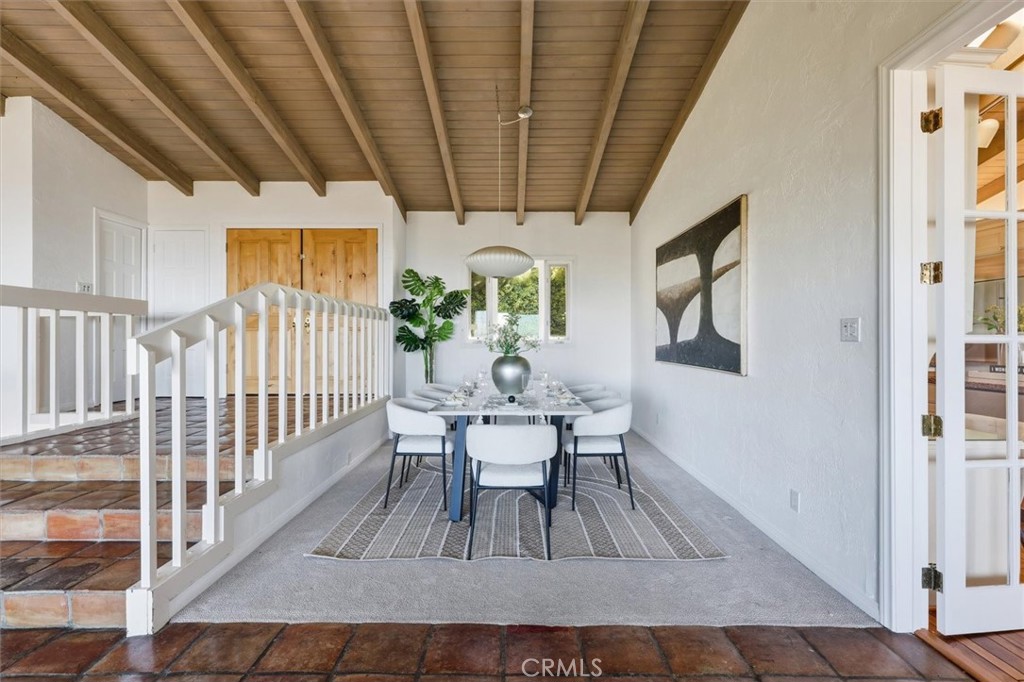 1308 Vía Coronel Palos Verdes Estates, CA 90274 - Photo 17 of 74 a dining room with furniture a rug and a chandelier
