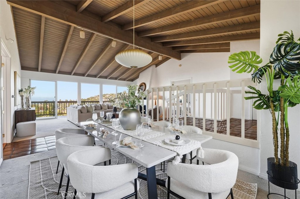 1308 Vía Coronel Palos Verdes Estates, CA 90274 - Photo 19 of 74 a dining room with furniture and a potted plant