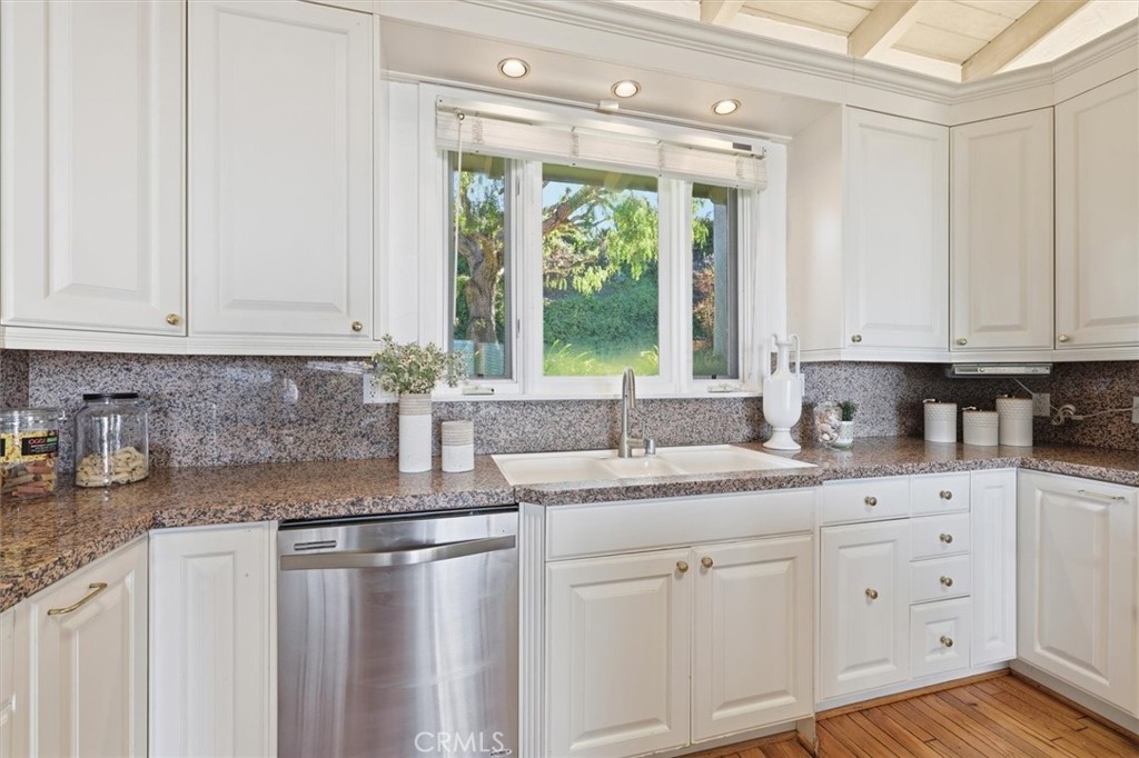 1308 Vía Coronel Palos Verdes Estates, CA 90274 - Photo 23 of 74 a kitchen with stainless steel appliances granite countertop a sink window and cabinets