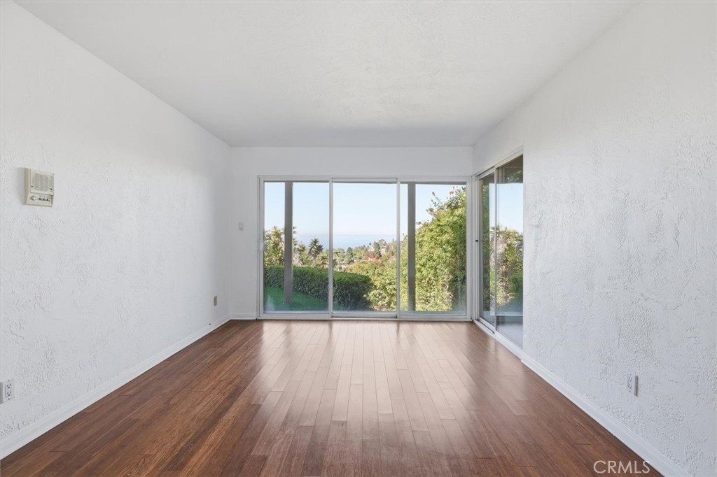 1308 Vía Coronel Palos Verdes Estates, CA 90274 - Photo 45 of 74 wooden floor in an empty room with a window